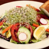 Garden Salad · Romaine hearts lettuce, roma tomatoes, sprouts, sun flower seeds and red cabbage. Tossed wit...