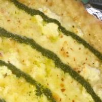 Bianco Verde Fat Slice · fresh mozzarella - ricotta - parmigiano - chili flakes - arugula pesto - asiago