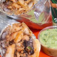 Fajita Burrito · Grilled chicken fajitas, refried beans, rice and mild salsa.