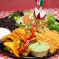 Vegan Plate · Farm fresh vegetables sautéed in garlic and olive oil served with salad, rice, beans, salsa,...
