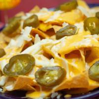 Nachos · Homemade chips, jalapenos and cheese.