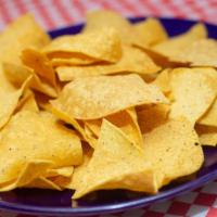 Homemade Thin Chips (Bag) · Our Chips are made with hand crafted non-GMO paper thin yellow, red and blue corn tortillas ...