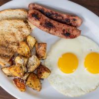 All-American Breakfast · Three eggs, three bacon, pork link or chicken apple sausage, with home fries and toast.
