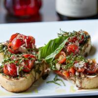 Bruschetta · Grilled ciabatta, grape tomato, fresh basil, garlic, white onion, pesto ricotta spread, and ...