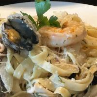Seafood Pasta · Fettuccine, mussels, clams, prawns, calamari, with a choice of garlic olive oil, pesto, alfr...