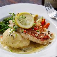 Chicken Piccata · A lightly breaded chicken breast, broccolini, garlic mashed potatoes topped with a white win...