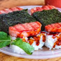 Traditional Spam Musubi · Premium low-sodium spam slice sandwiched w/ sushi rice, unagi + shoyu sauce, & wrapped w/ dr...