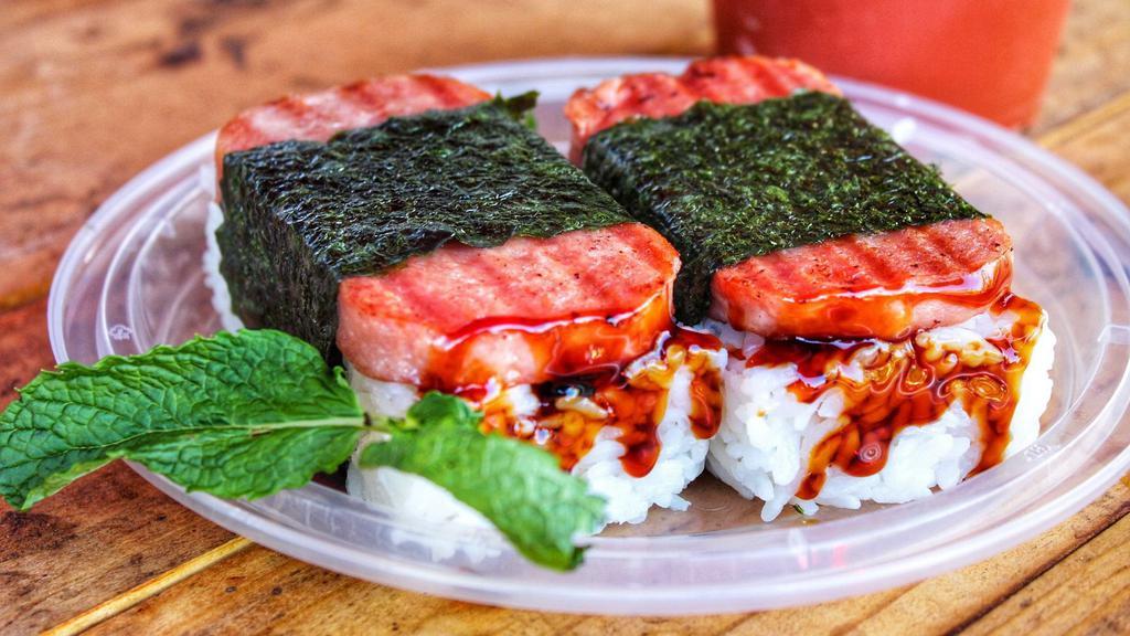 Traditional Spam Musubi · Premium low-sodium spam slice sandwiched w/ sushi rice, unagi + shoyu sauce, & wrapped w/ dried seaweed.