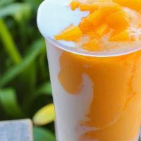 Mango Smoothie · Mango smoothie made w/ real mangoes, milk, condensed milk, and blended w/ ice.