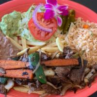 Platillo de Carne Asada · Grilled Steak seasoned with Onions, Jalapeños, Carrots, Zucchini, served with Rice, Re-fried...