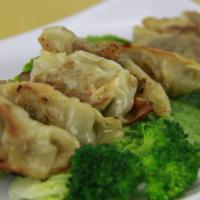 A-1. Goon Mandoo · Fried dumplings (8 pcs) beef and vegetables.
