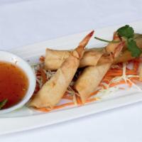 Shrimp Rolls · Six pieces. Deep-fried marinated prawns and bacon served with sweet chili sauce.