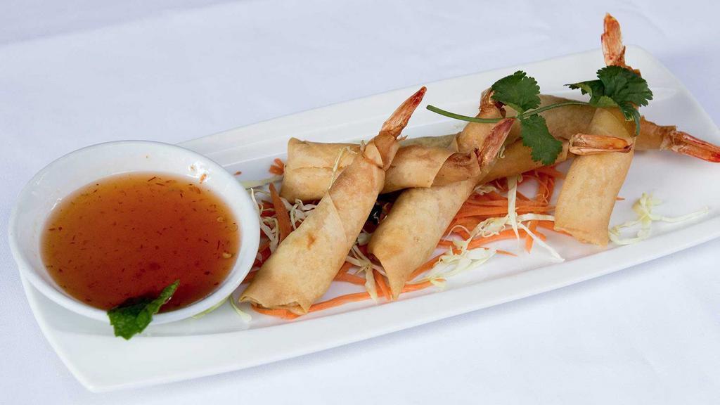 Shrimp Rolls · Six pieces. Deep-fried marinated prawns and bacon served with sweet chili sauce.