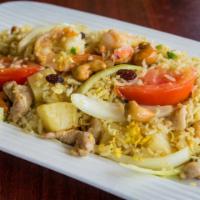 Pineapple Fried Rice · Steamed jasmine rice stir fried with egg, chicken, prawns, pineapple, onions, tomatoes, cash...