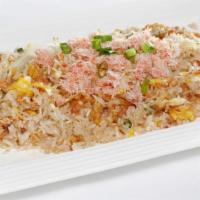 Crab Meat Fried Rice · Steamed jasmine rice stir fried with crab meat egg, tomatoes, green onion, and Thai seasonin...