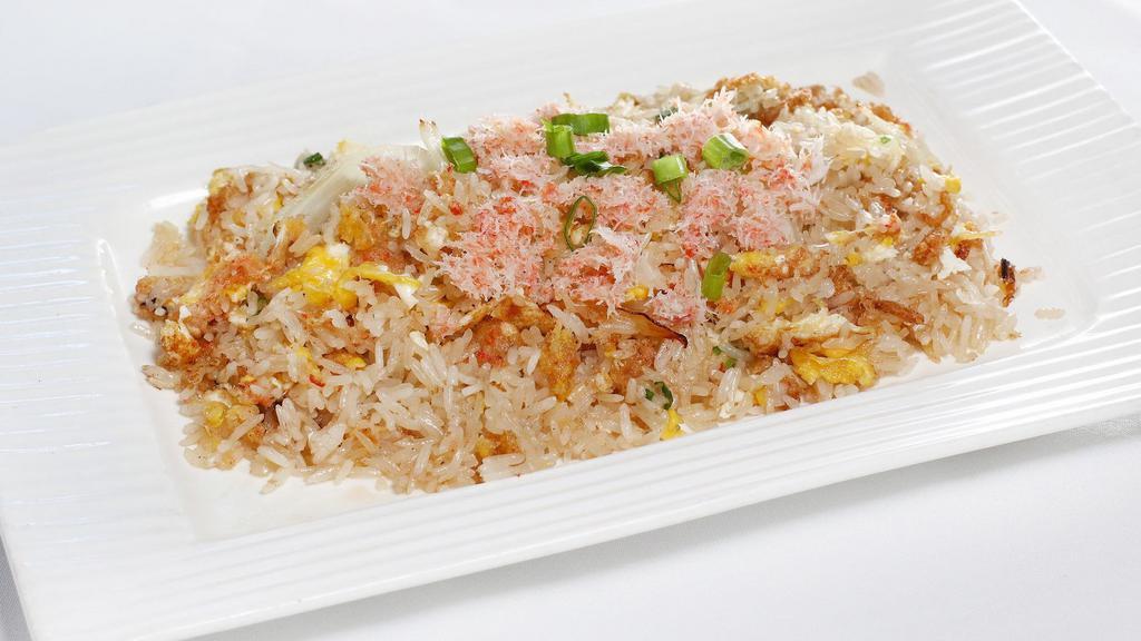 Crab Meat Fried Rice · Steamed jasmine rice stir fried with crab meat egg, tomatoes, green onion, and Thai seasoning sauce with crab paste.
