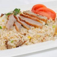 Duck Fried Rice · Steamed jasmine rice stir fried with boneless roast duck egg, tomatoes, green onion, and Tha...