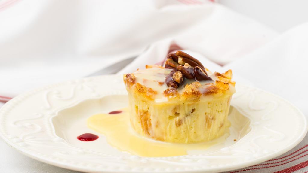 Bread Pudding · Frangelico or white chocolate sauce, raspberry coulis, toasted pecans.