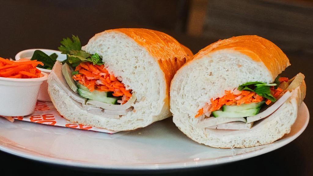 Ha Noi Pork Loaf · Loaded with silky Vietnamese pork loaf (chả) and the traditional fillings: mayo, cucumber, pickled carrots & daikon, jalapenos, cilantro, and house sauce (soy based)