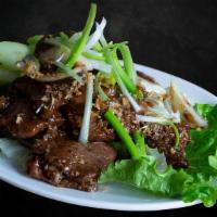 Black Pepper Beef · Top sirloin Beef stir-fried with Thai Black Peppers, Yellow and Green Onion.