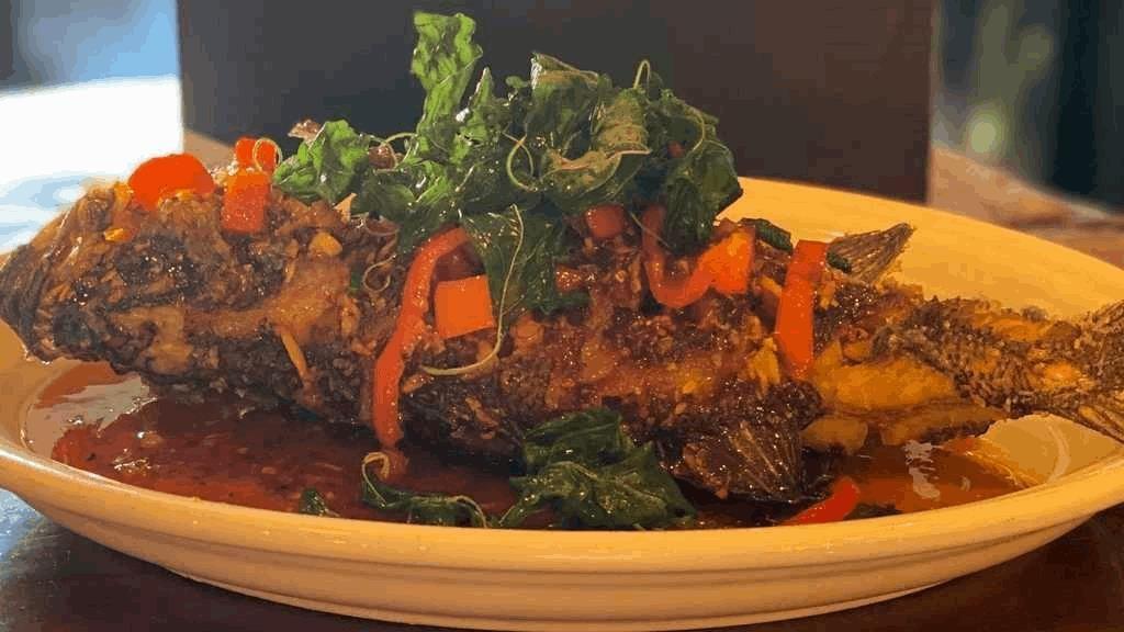 Lers Ros Special Bass · Perfect fried Black Bass with a topping of Sweet Chili Sauce and Crispy Basil Leaves.
