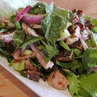 Duck Salad · A very popular Lers Ros Duck Salad.  Chunk of roasted duck mixed with rice powder, chili pow...