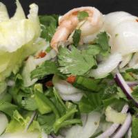 Seafood Salad · Seafood; shrimps, calamari and fish ball mixed in fresh lime based dressing with cilantro, s...