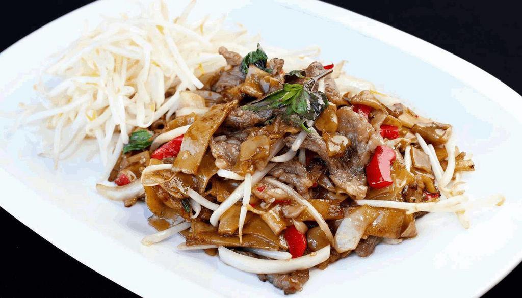 Pad Kee Mow · Spicy pan-fried flat noodle with basil, bell peppers, bean sprout, yellow onion.
