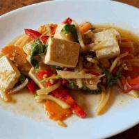 Spicy Tofu · Tofu stir-fried with garlic, Thai fresh chili, basil leaves and red bell peppers in Thai tra...