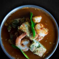 Fried Egg Tamarind Soup · Fried egg with acacia, shrimps in house made tamarind and dried chili soup. Spicy and sour.