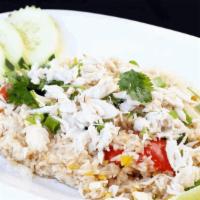 Crab Meat Fried Rice · Fried rice with Crab meat, egg, tomatoes, green onion, yellow onion and cilantro.