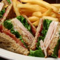 Club Sandwich · Favorite. Ham, turkey, bacon, iceberg, lettuce, tomato and cheese and your choice of bread.