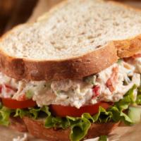 Chicken Salad Sandwich · Chicken salad, iceberg, lettuce, tomato and cheese, and your choice of bread.