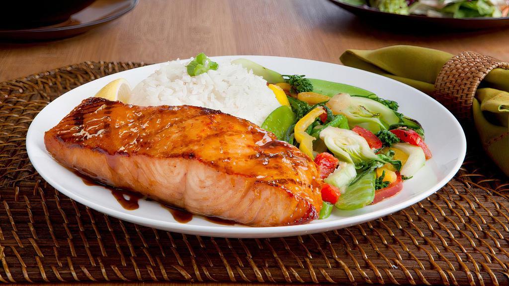 Salmon Teriyaki · Grilled salmon marinated in fine wine served with homemade teriyaki sauce. Served with stir-fried vegetables over rice.