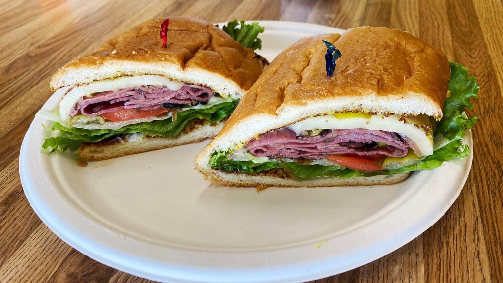 Pastrami Supreme · Sliced pastrami, Swiss cheese, peperoncino, lettuce, and onions on a French roll.