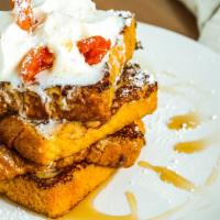 apricot cream cheese french toast · Texas toast, layered with cream cheese and apricot jam. Topped with a maple syrup drizzle, w...