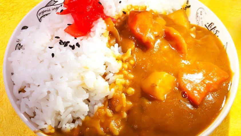Curry Rice · Japanese style chicken curry over rice with pickles and soft-cooked egg.
