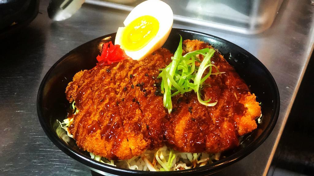 Chicken Katsu Don · Crispy chicken fried katsu on top of rice with cabagge and half soft boiled egg.