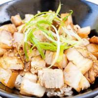 Chashu Don · Chashu don, sliced pork and green onion with sauce on rice.