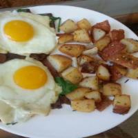 Breakfast Sliders · Two sunny side up eggs. Served on top of bacon, garlic, spinach, and swiss cheese potatoes.
