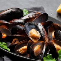 Mussels · Sautéed in lemon white wine and garlic sauce.