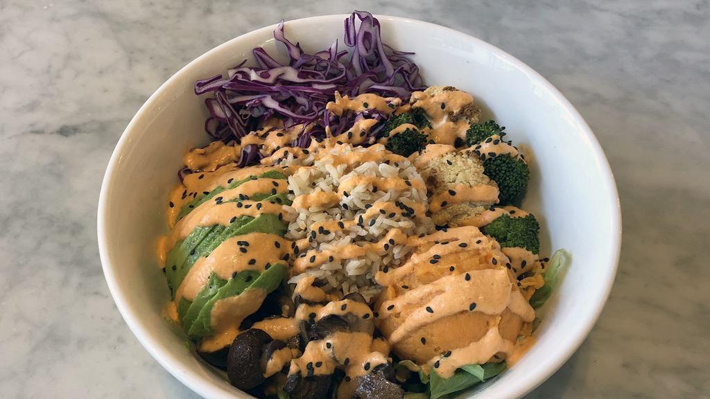 Golden Gate Bowl · Top seller. Jasmine brown rice, cabbage, avocado, yams, roasted broccoli and cauliflower, roasted mushrooms, and mixed greens. Red pepper almond dressing.