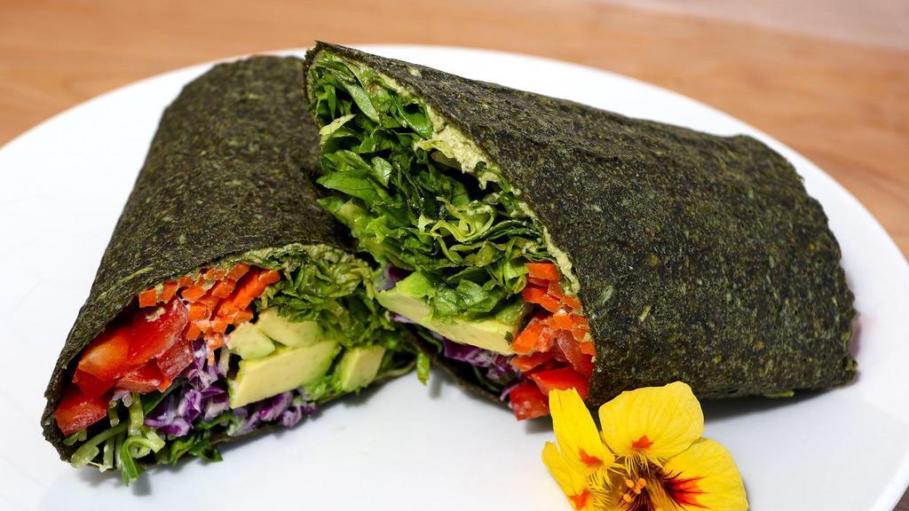 Veggie Wrap · Gluten-free. Hummus, avocado, carrots, sprouts, red peppers, romaine lettuce, cabbage, cucumber, and oil-free creamy dill hemp dressing. Served in a raw spinach wrap.