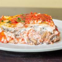 Truffle Mushroom Lasagna (TM) · Three varieties of fresh mushrooms, tomato sauce, premium vegan cheese, cashew cream made fr...