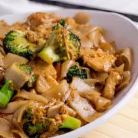 Pad See Ew (PSW) · Fresh flat pan-fried noodles with broccoli, carrots and egg. Medium spiced