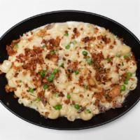 Adult Mac & Cheese. · Mac & Cheese with prosciutto, peas, and breadcrumbs