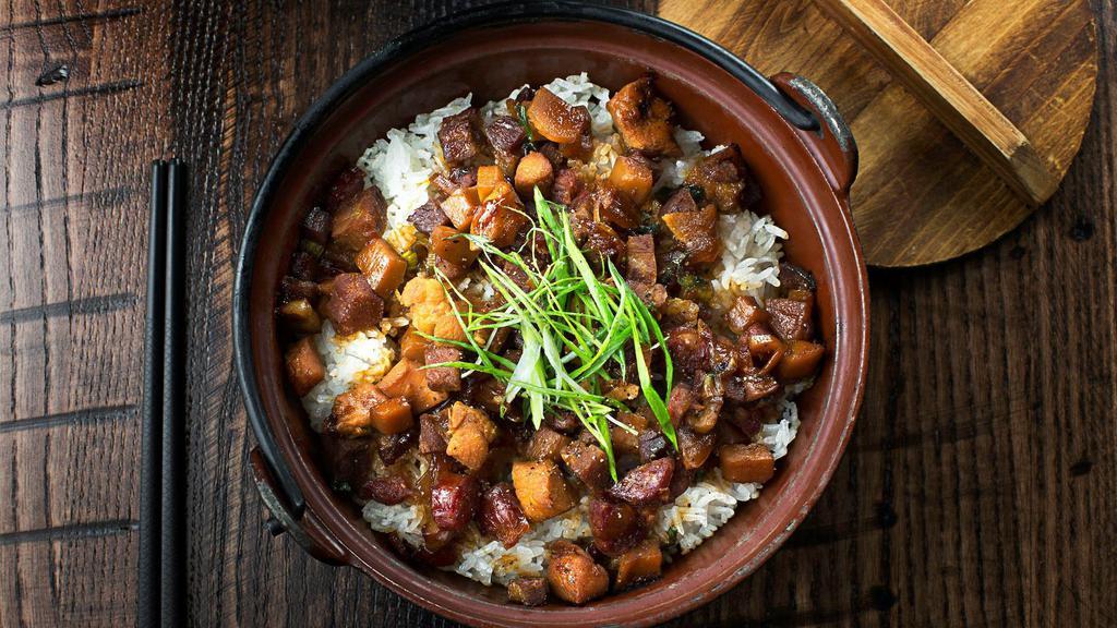 Iron Pot Rice · Chinese sausage, chicken, BBQ pork, onion, king trumpet mushrooms, and toasted rice.