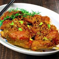 Garlic Spare Ribs · 5 Spice marinated pork ribs lightly fried then tossed in fresh garlic