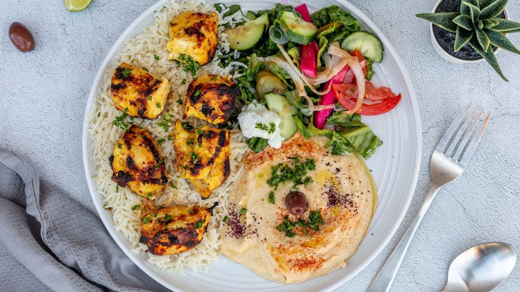 Chicken Kebob Plate · Served with hummus, rice, salad and pita bread.