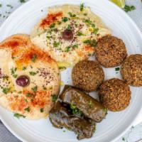 Veggie Combo Plate · Five falafels, hummus, baba ganoush, four dolmas and pita.